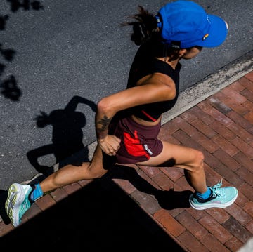 female running fast on brick path