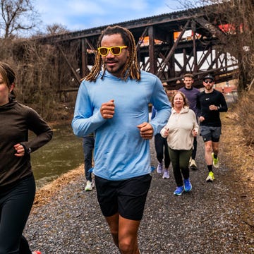 group of runners on gravel trail
