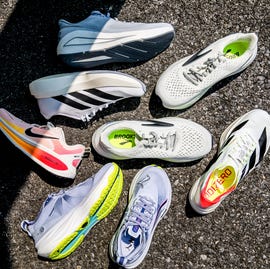 different running shoes on a concrete surface